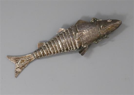 An engraved white metal articulated fish with hinged lid, 12cm.